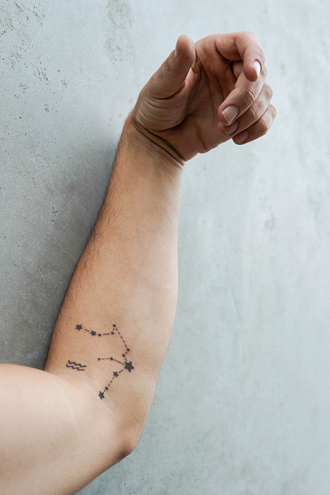 Aquarius constellation stars temporary tattoo on a forearm