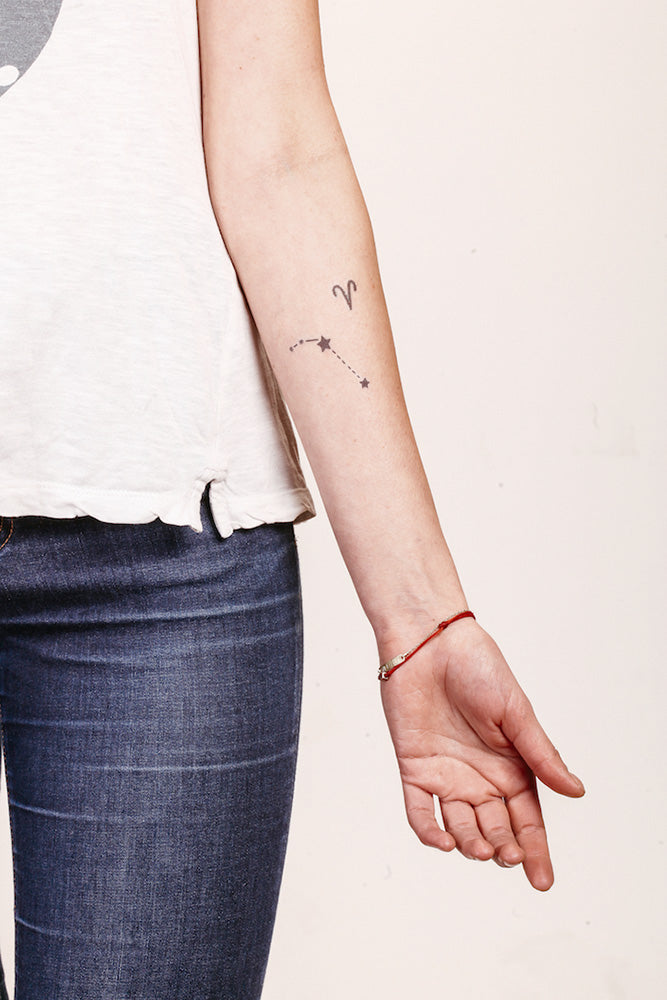 Aries star constellation tattoo on a forearm