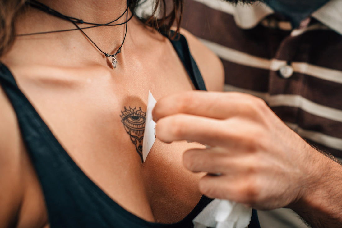 a woman with a tattoo on her chest